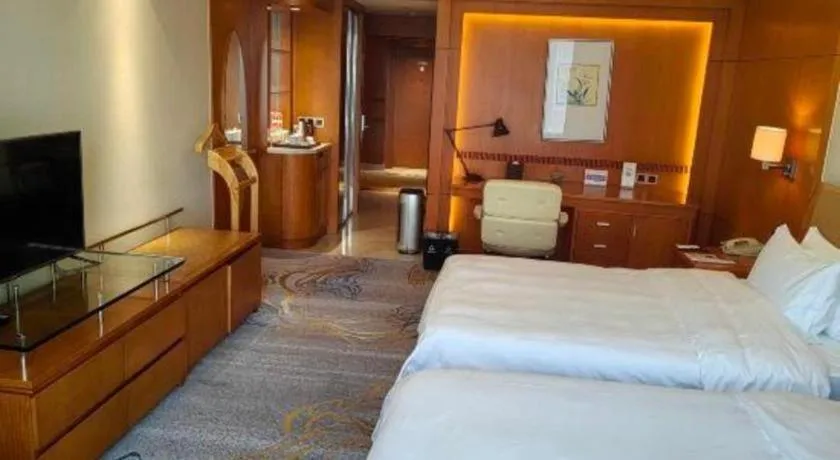 Bed in Fuyang International Trade Centre Hotel