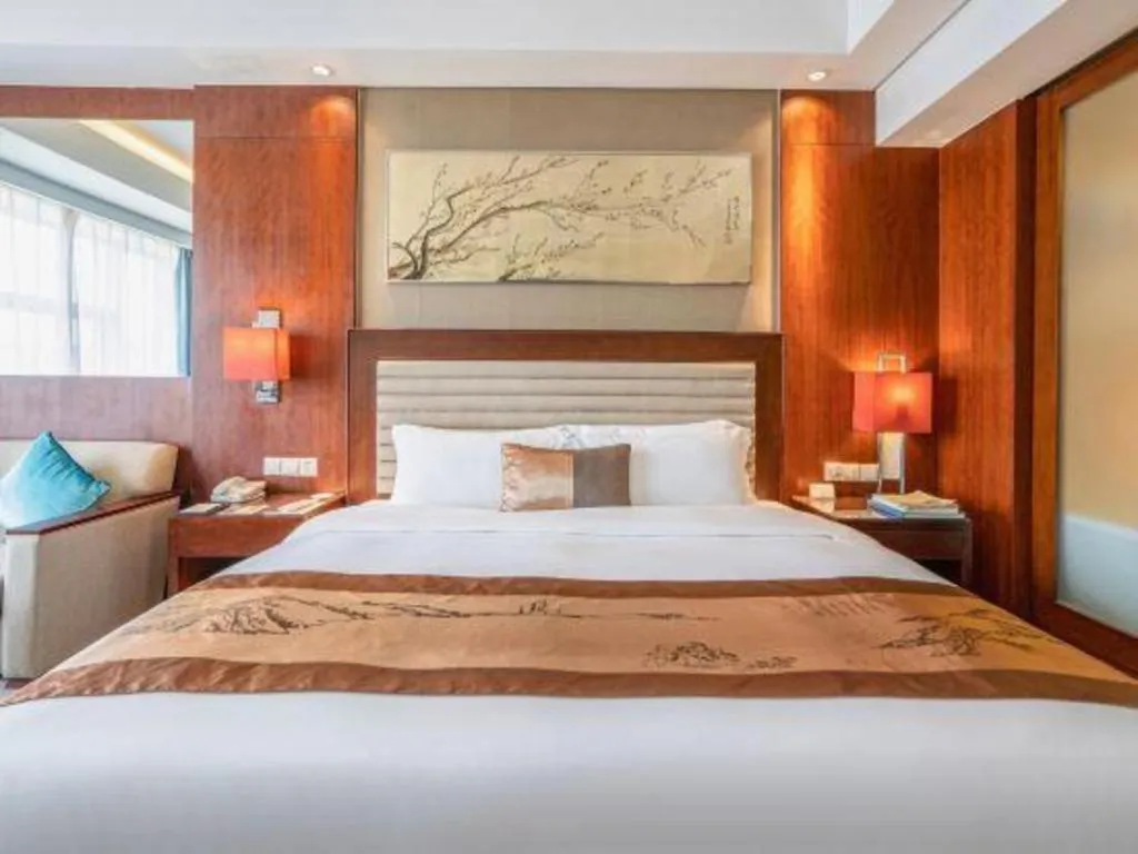 Bed in Fuyang International Trade Centre Hotel