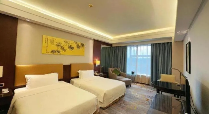 Bed in Fuyang International Trade Centre Hotel