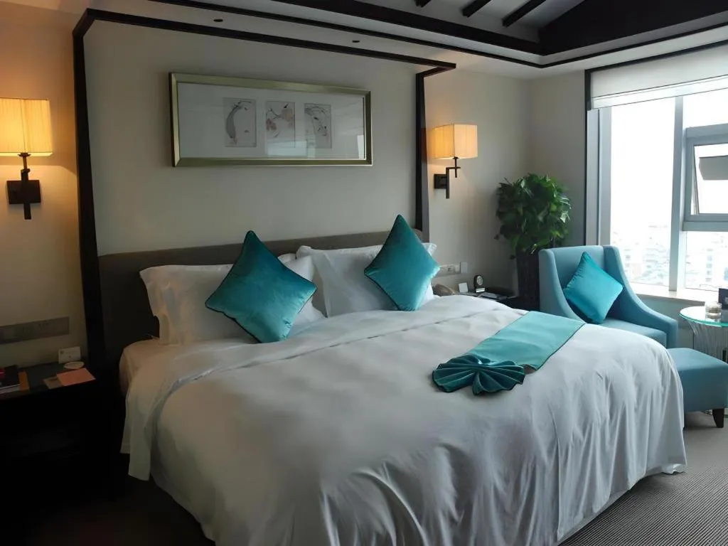 Bed in Fuyang International Trade Centre Hotel