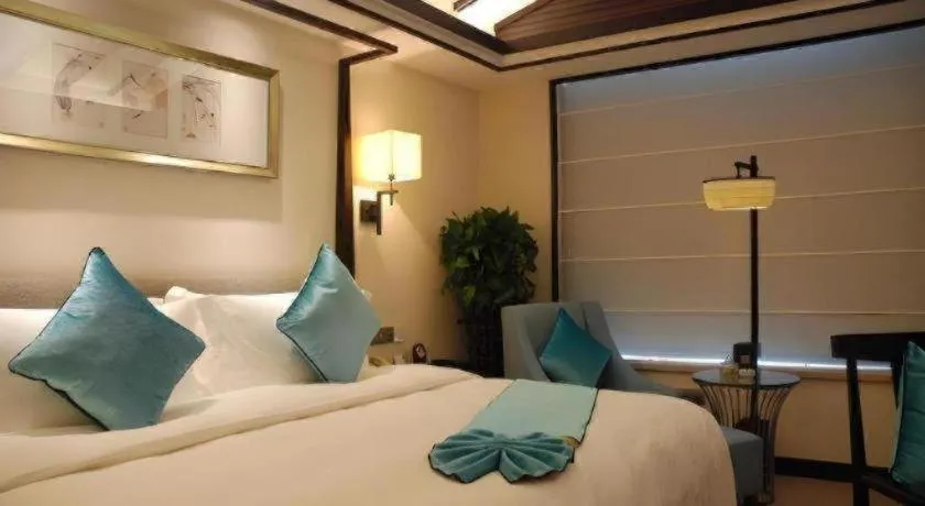 Bed in Fuyang International Trade Centre Hotel