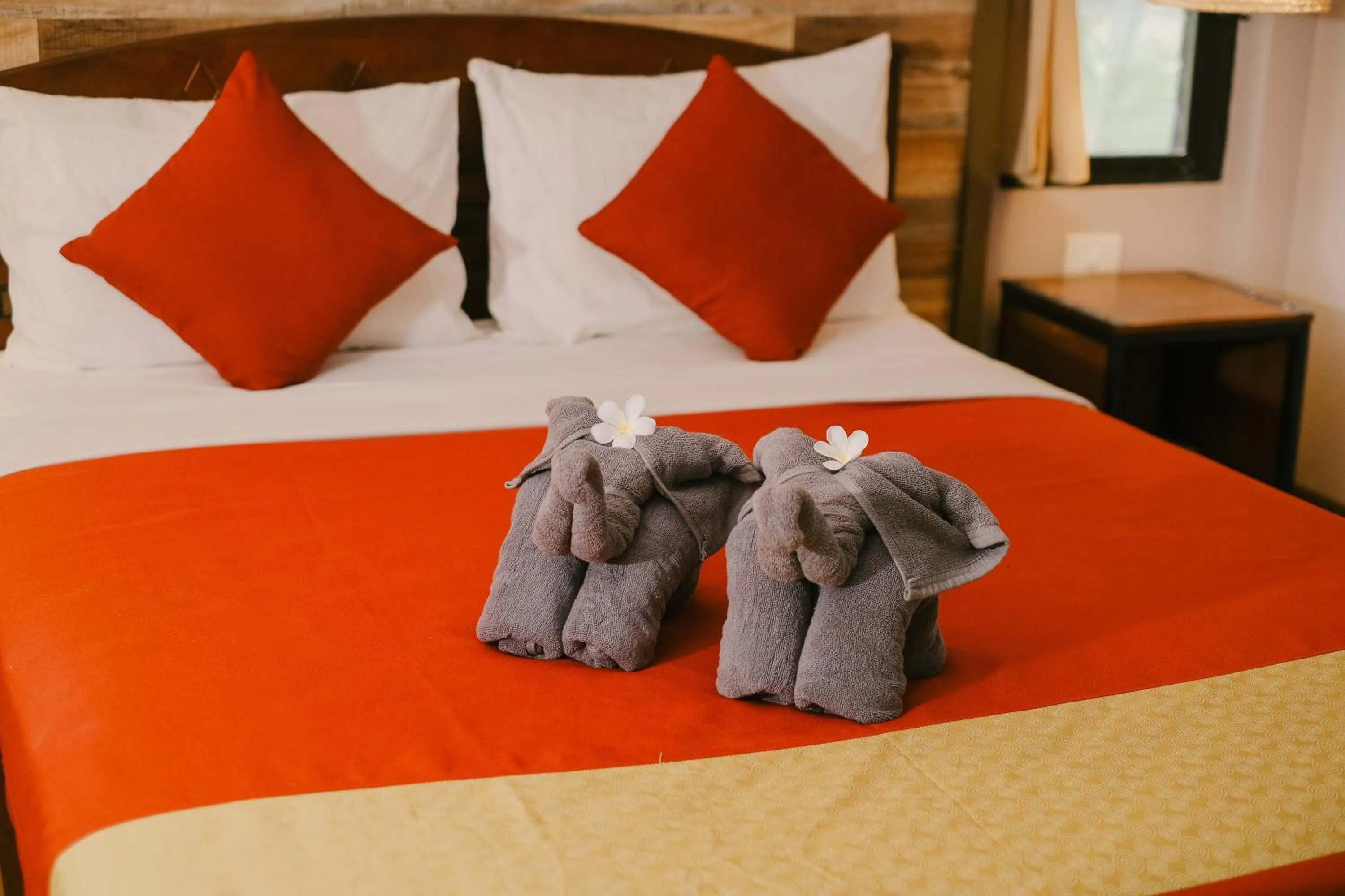 Bed in JOY Bungalow Resort and Restaurant