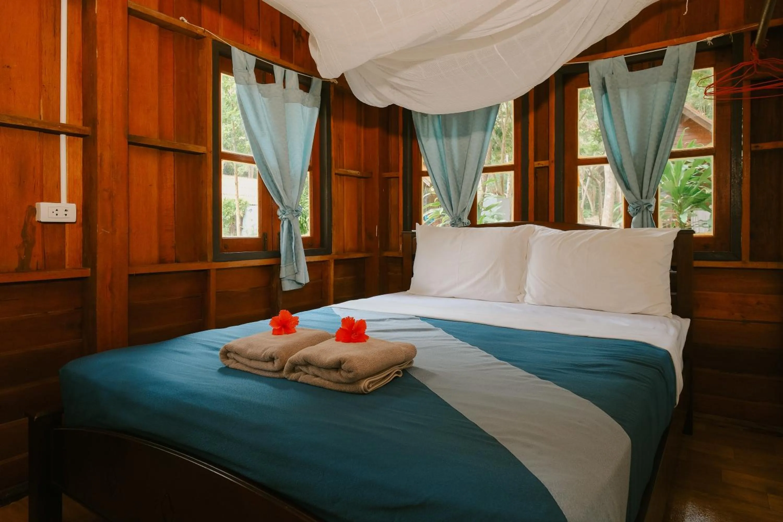 Bed in JOY Bungalow Resort and Restaurant