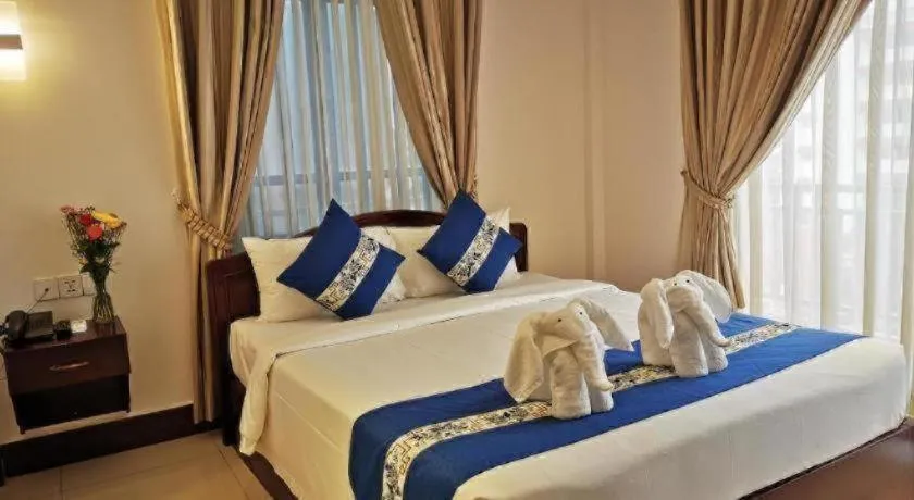 Bed in Jun Yue Hotel