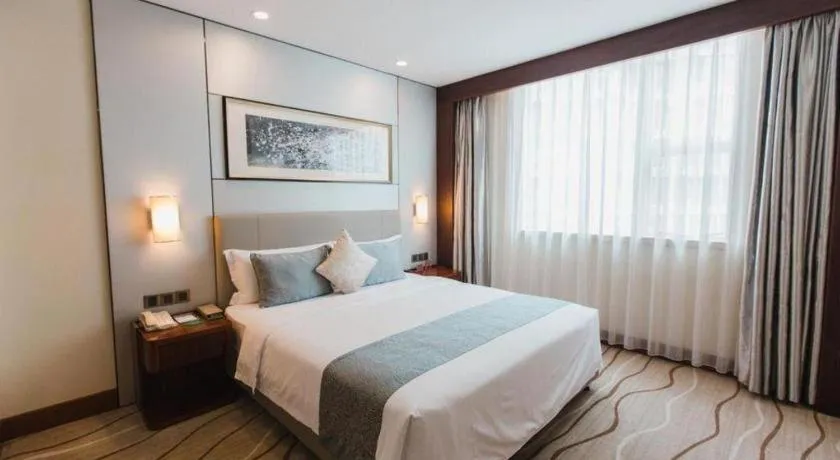 Bed in Grand Soluxe Zhongyou Hotel Shenzhen