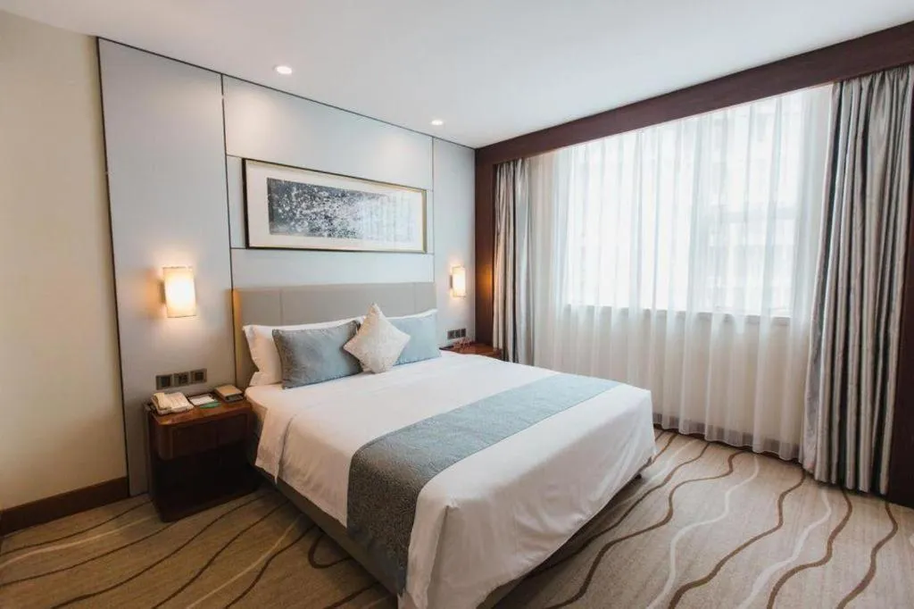 Bed in Grand Soluxe Zhongyou Hotel Shenzhen