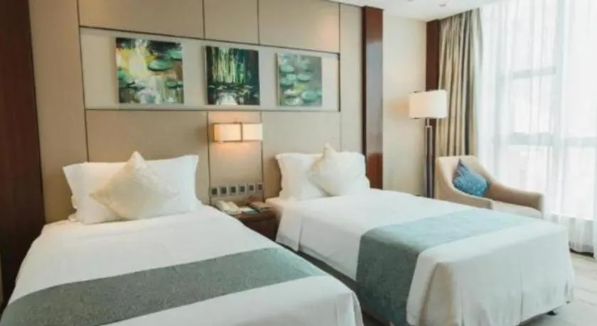 Bed in Grand Soluxe Zhongyou Hotel Shenzhen