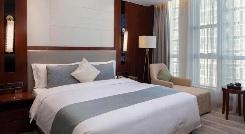 Bed in Grand Soluxe Zhongyou Hotel Shenzhen