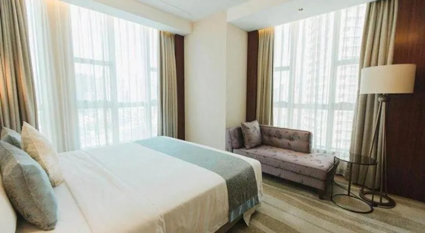 Bed in Grand Soluxe Zhongyou Hotel Shenzhen