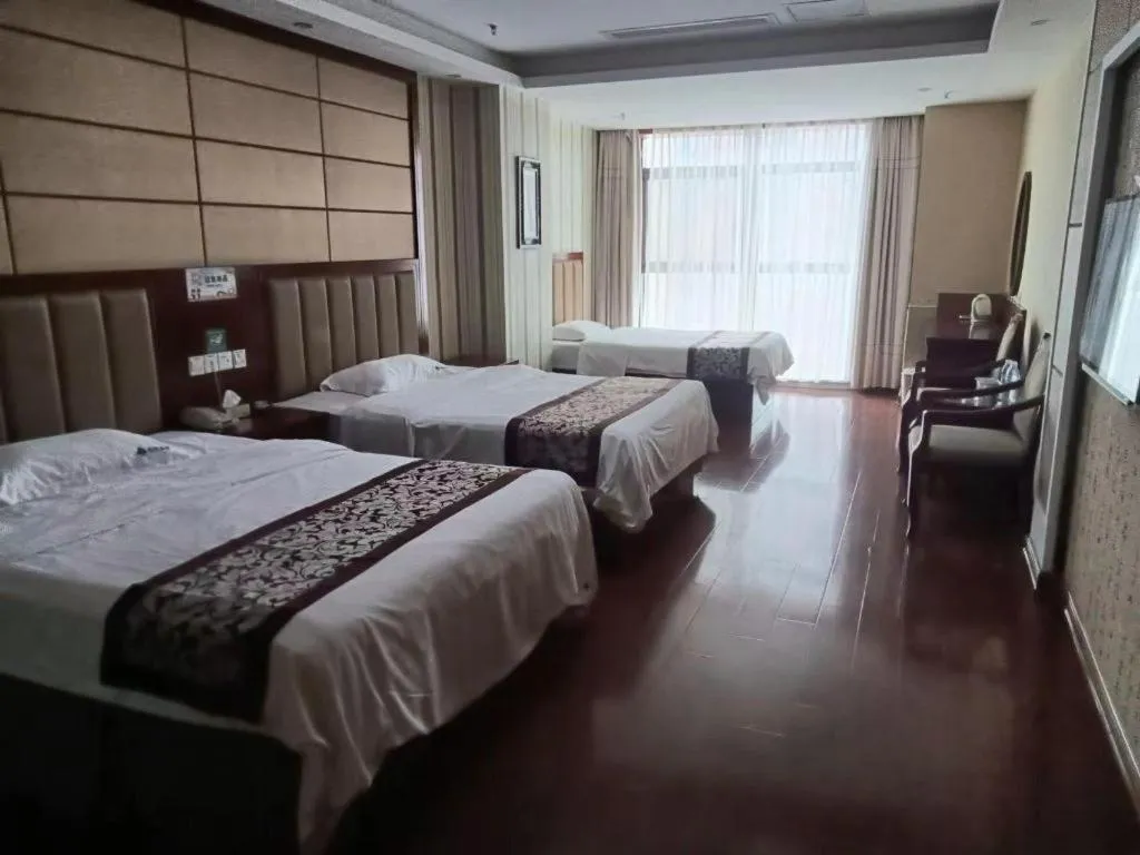 Bed in GreenTree Inn Chuzhou City Quanjiao County High-Speed Italy Trade City Business Hotel