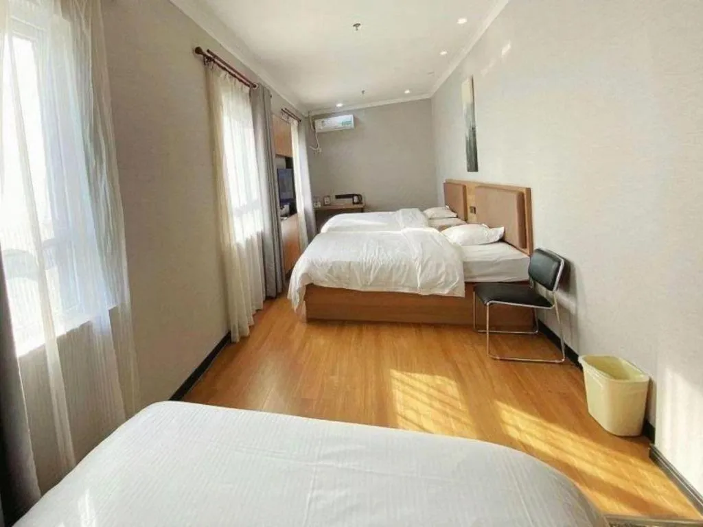 Bed in GreenTree Inn Taizhou New District Hospital of Renmin Hospital Mingliu Express Hotel