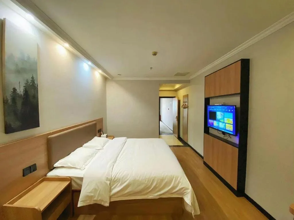 Bed in GreenTree Inn Taizhou New District Hospital of Renmin Hospital Mingliu Express Hotel