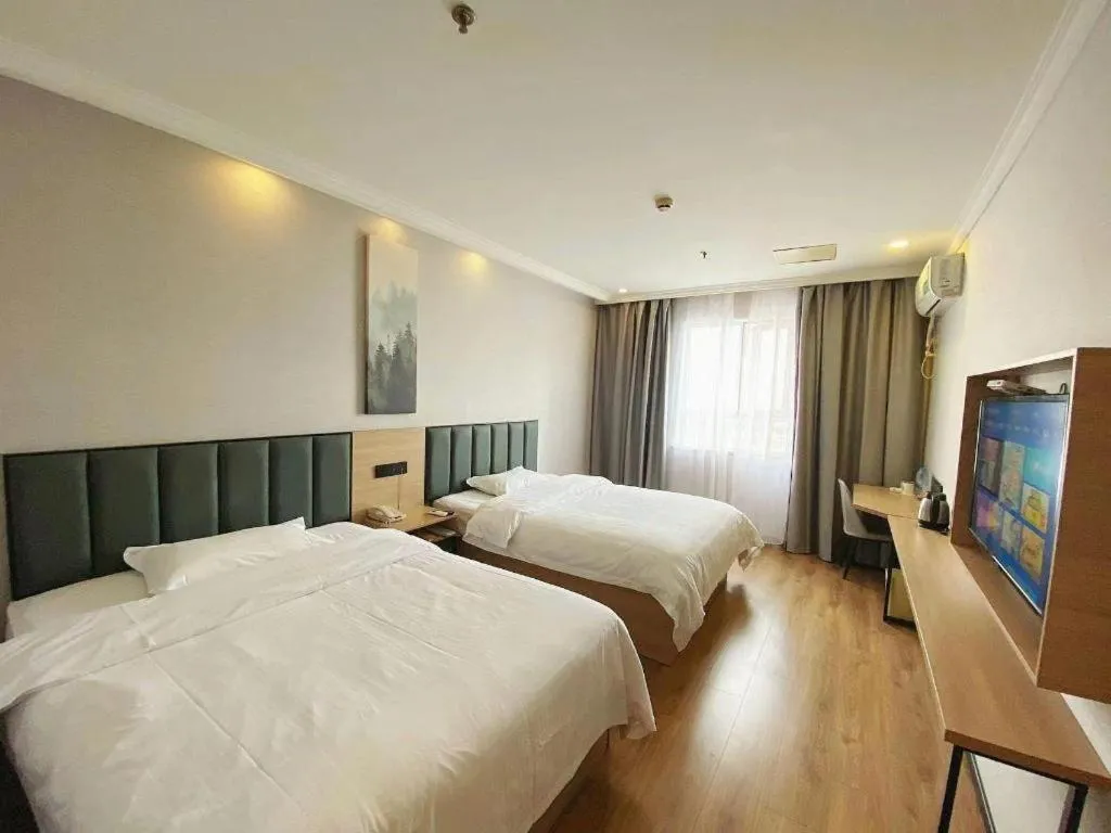 Bed in GreenTree Inn Taizhou New District Hospital of Renmin Hospital Mingliu Express Hotel