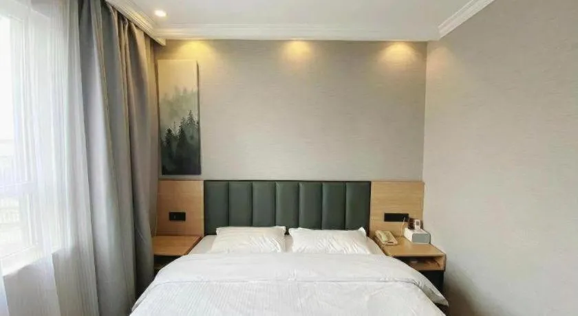 Bed in GreenTree Inn Taizhou New District Hospital of Renmin Hospital Mingliu Express Hotel