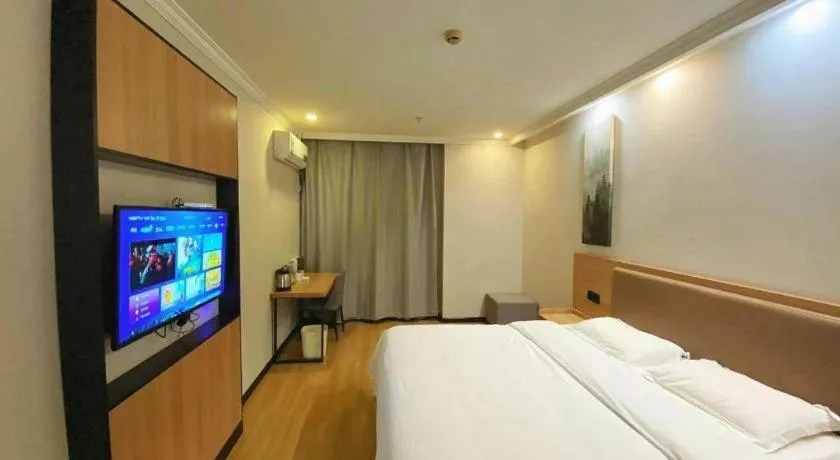 Bed in GreenTree Inn Taizhou New District Hospital of Renmin Hospital Mingliu Express Hotel