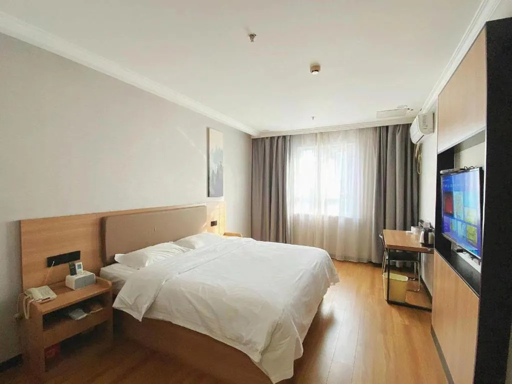 Bed in GreenTree Inn Taizhou New District Hospital of Renmin Hospital Mingliu Express Hotel