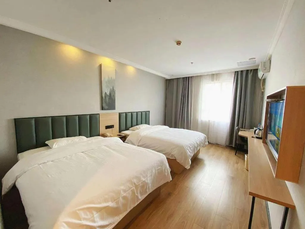 Bed in GreenTree Inn Taizhou New District Hospital of Renmin Hospital Mingliu Express Hotel