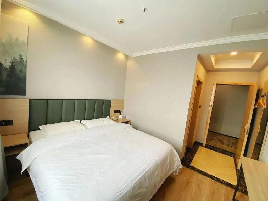 Bed in GreenTree Inn Taizhou New District Hospital of Renmin Hospital Mingliu Express Hotel