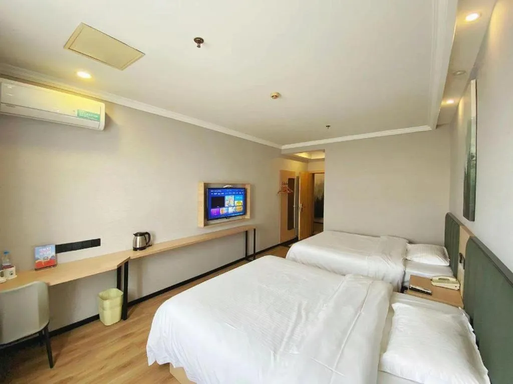 Bed in GreenTree Inn Taizhou New District Hospital of Renmin Hospital Mingliu Express Hotel