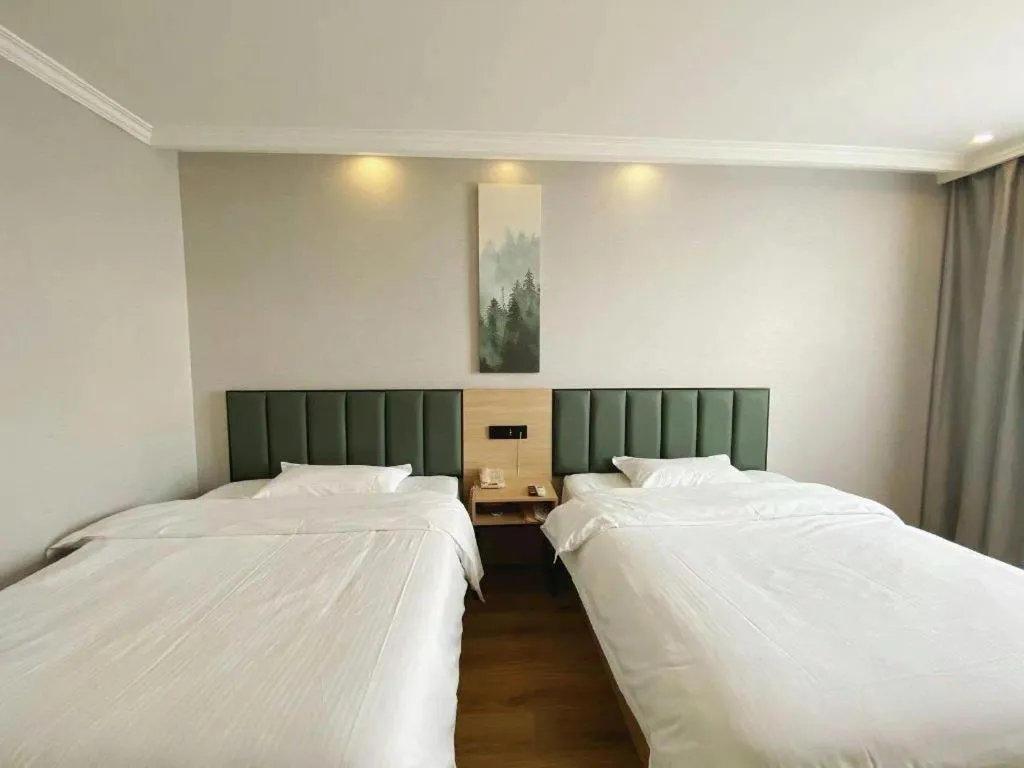 Bed in GreenTree Inn Taizhou New District Hospital of Renmin Hospital Mingliu Express Hotel