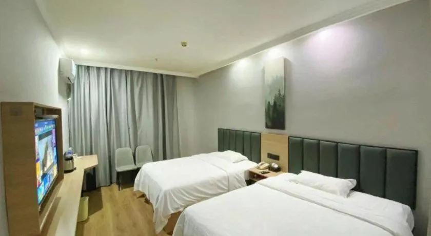 Bed in GreenTree Inn Taizhou New District Hospital of Renmin Hospital Mingliu Express Hotel
