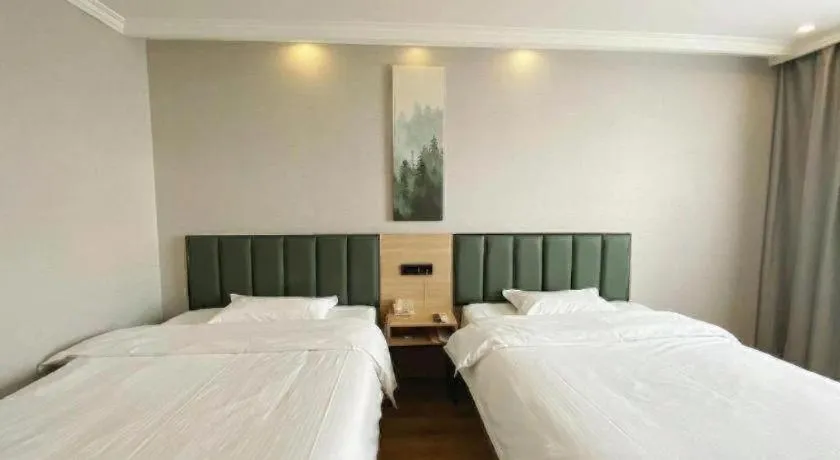 Bed in GreenTree Inn Taizhou New District Hospital of Renmin Hospital Mingliu Express Hotel