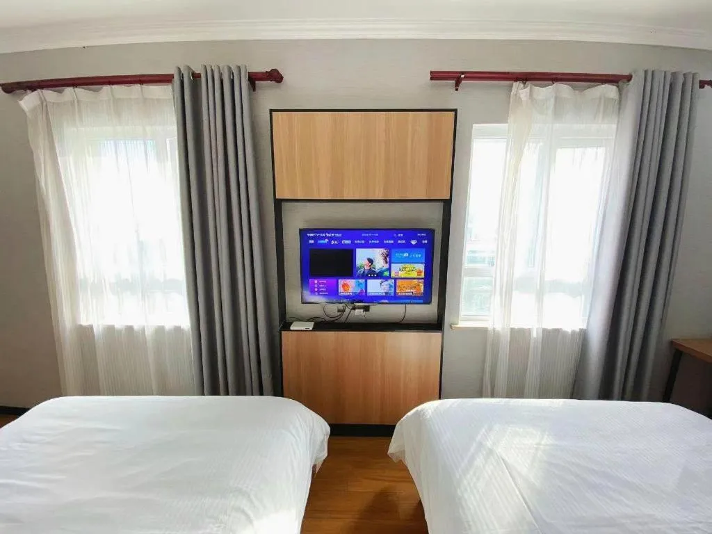 Bed in GreenTree Inn Taizhou New District Hospital of Renmin Hospital Mingliu Express Hotel