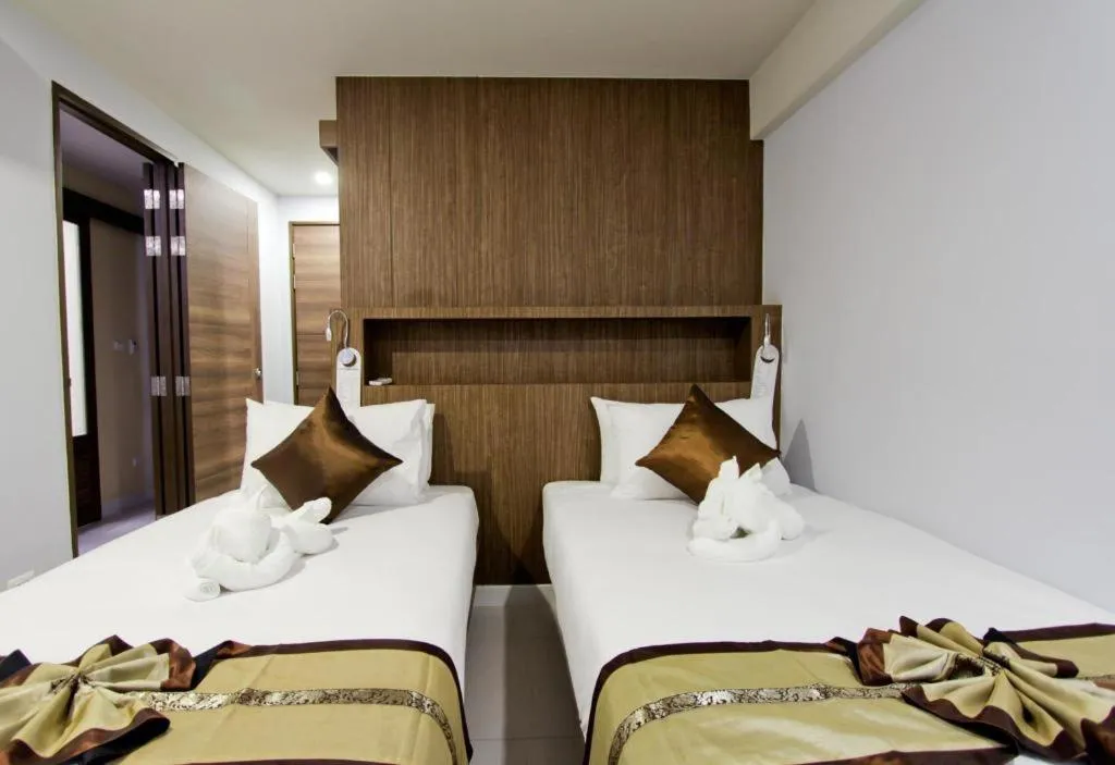 Bed in Elegancy Sansabai Hotel