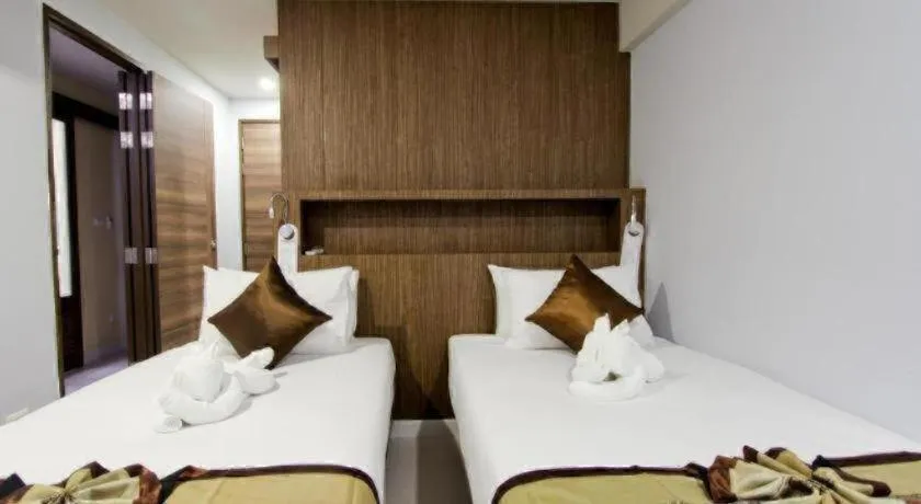 Bed in Elegancy Sansabai Hotel