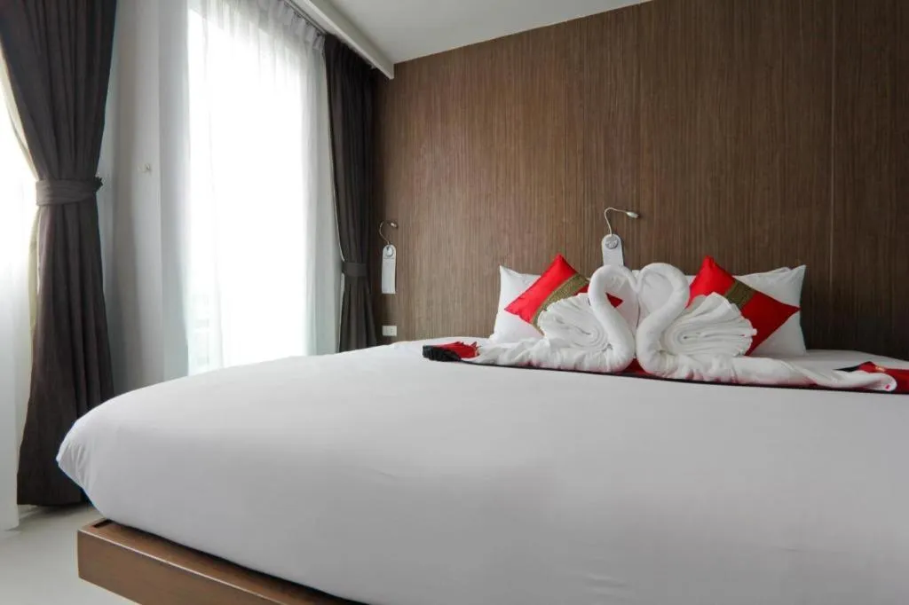 Bed in Elegancy Sansabai Hotel