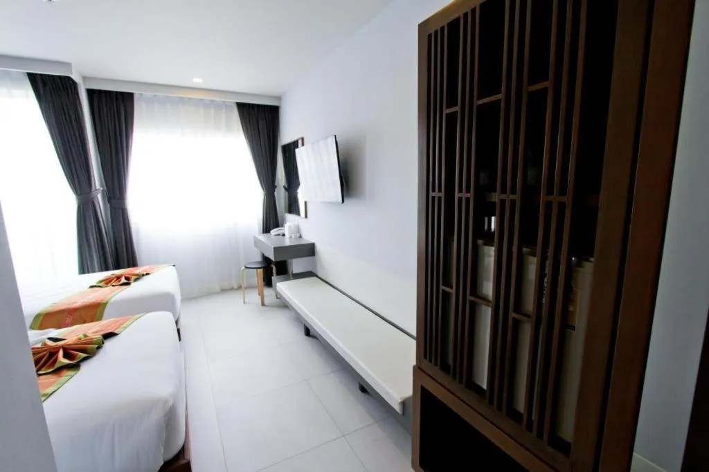 Bed in Elegancy Sansabai Hotel