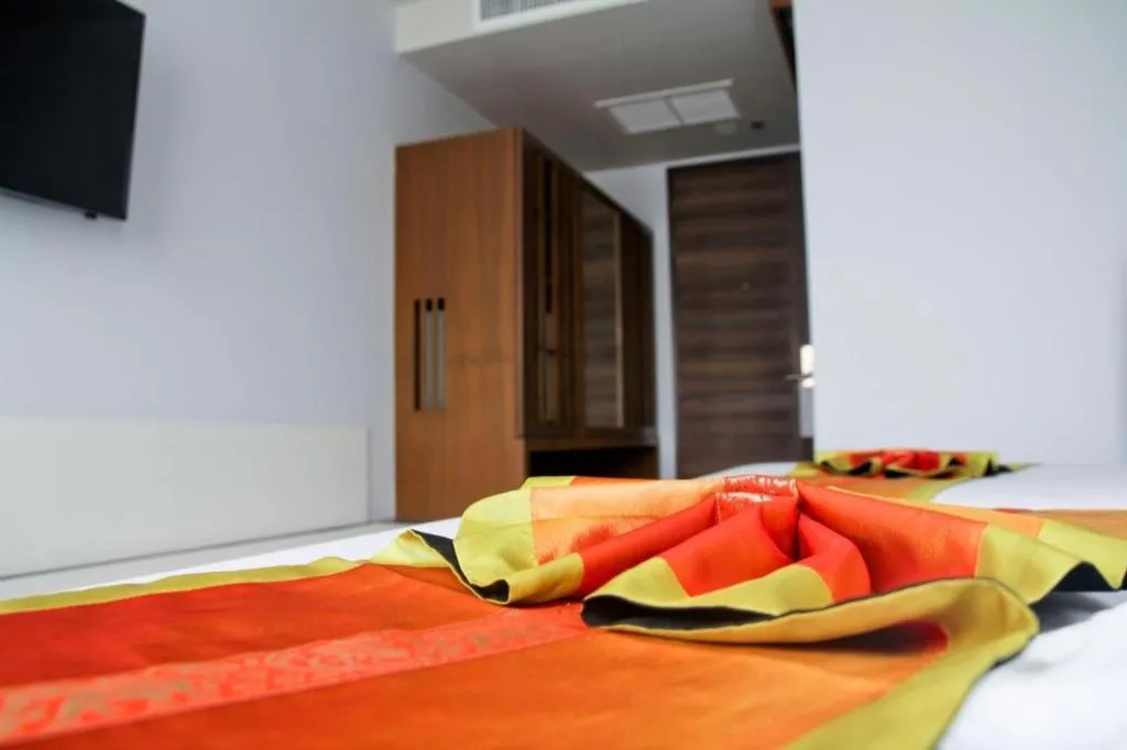 Bed in Elegancy Sansabai Hotel