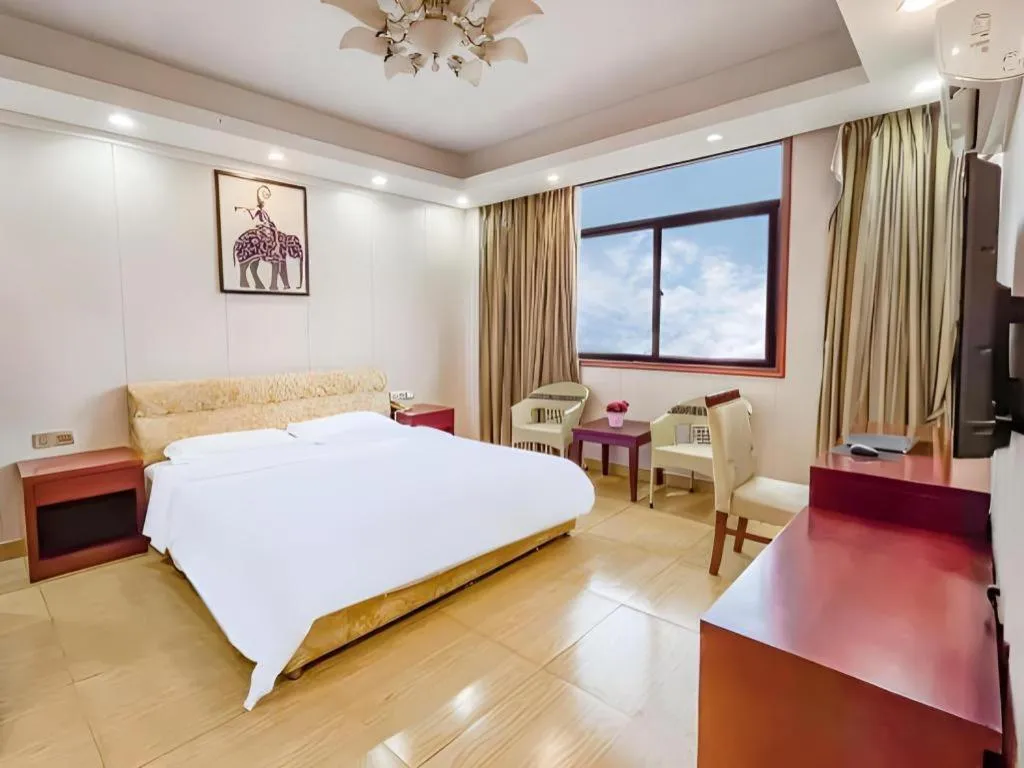 Bed in Jian Guo Grand Hotel