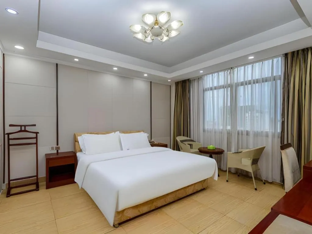 Bed in Jian Guo Grand Hotel