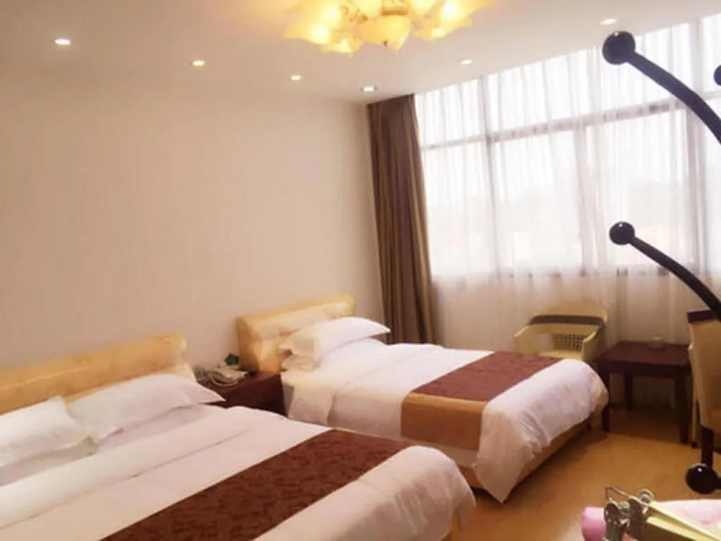 Bed in Jian Guo Grand Hotel