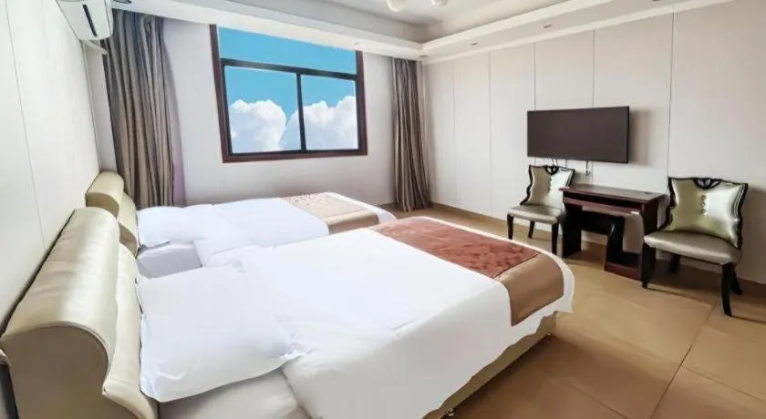 Bed in Jian Guo Grand Hotel