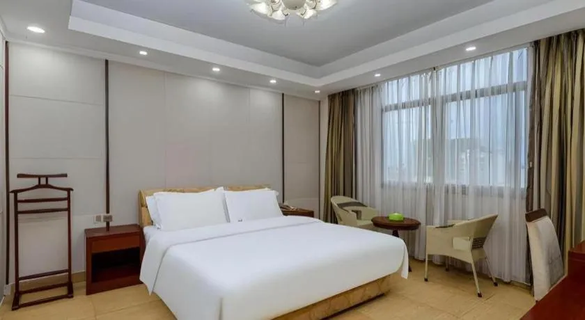 Bed in Jian Guo Grand Hotel