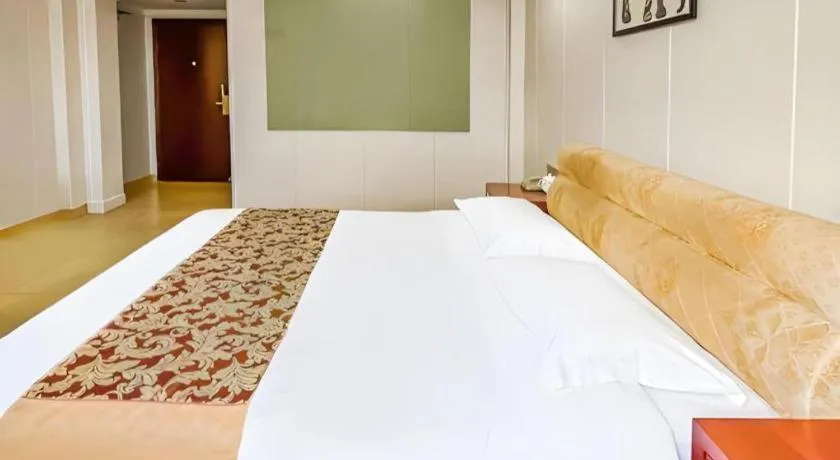 Bed in Jian Guo Grand Hotel