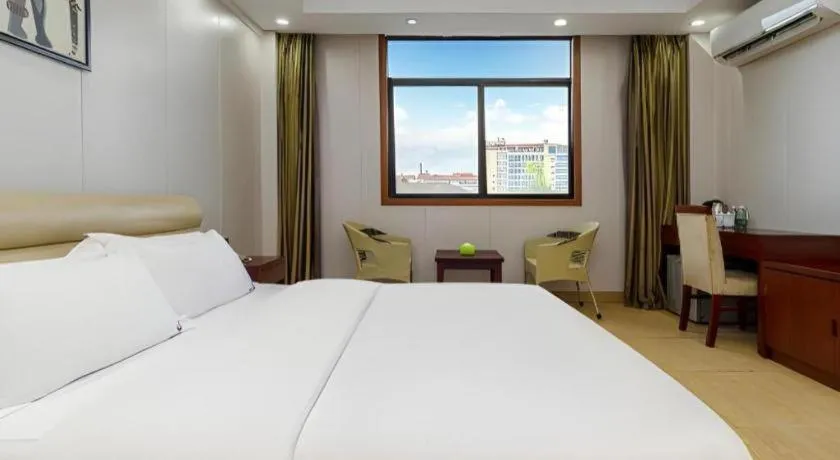 Bed in Jian Guo Grand Hotel