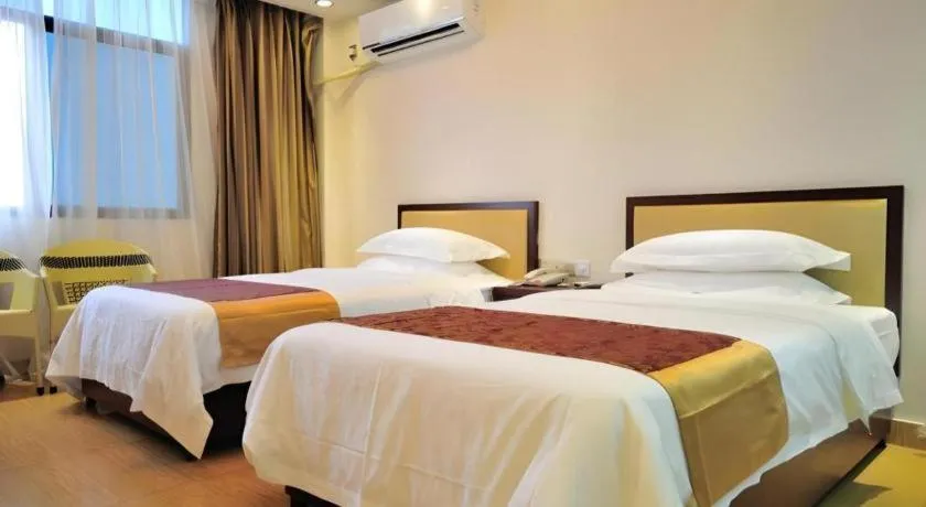 Bed in Jian Guo Grand Hotel