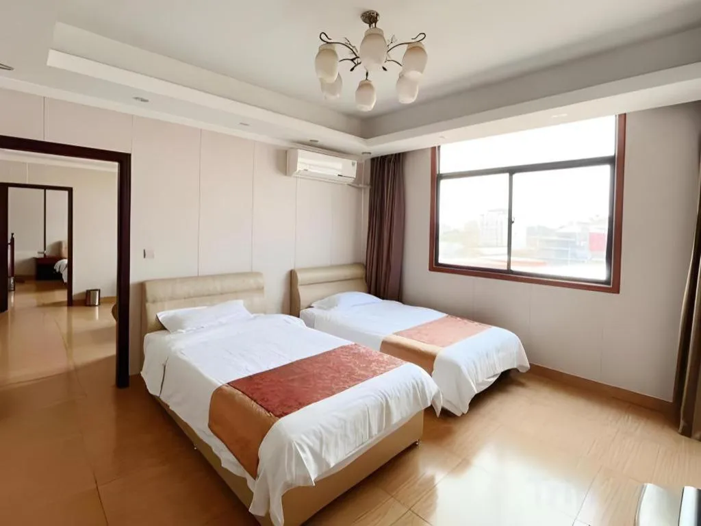 Bed in Jian Guo Grand Hotel