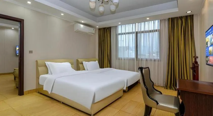 Bed in Jian Guo Grand Hotel