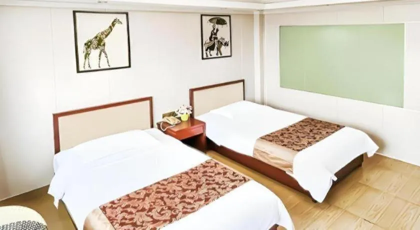 Bed in Jian Guo Grand Hotel