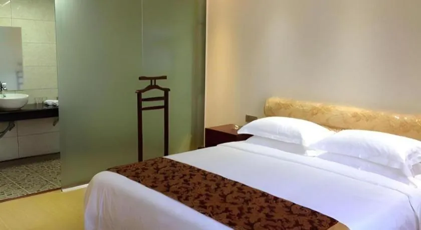 Bed in Jian Guo Grand Hotel