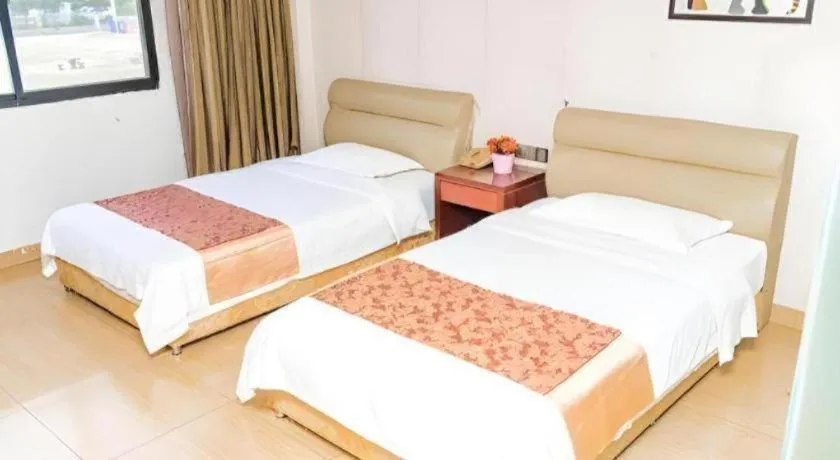 Bed in Jian Guo Grand Hotel