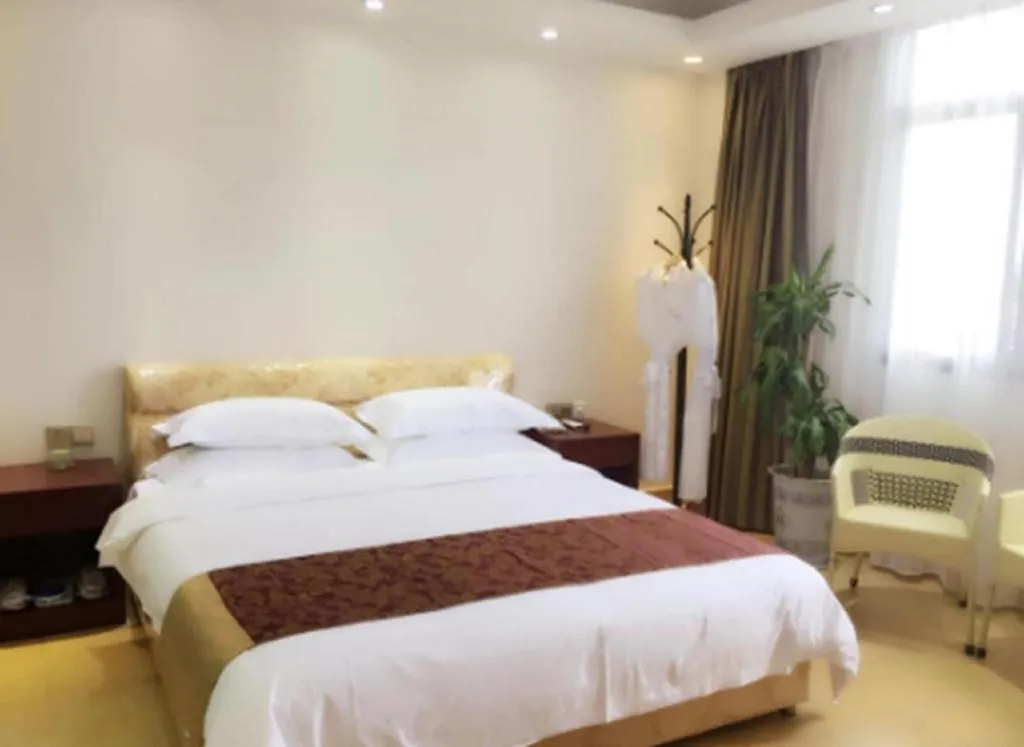 Bed in Jian Guo Grand Hotel