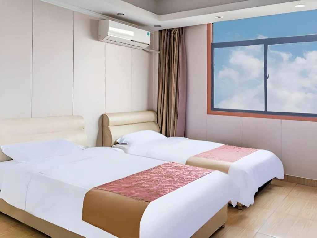 Bed in Jian Guo Grand Hotel