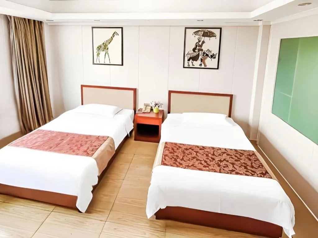 Bed in Jian Guo Grand Hotel