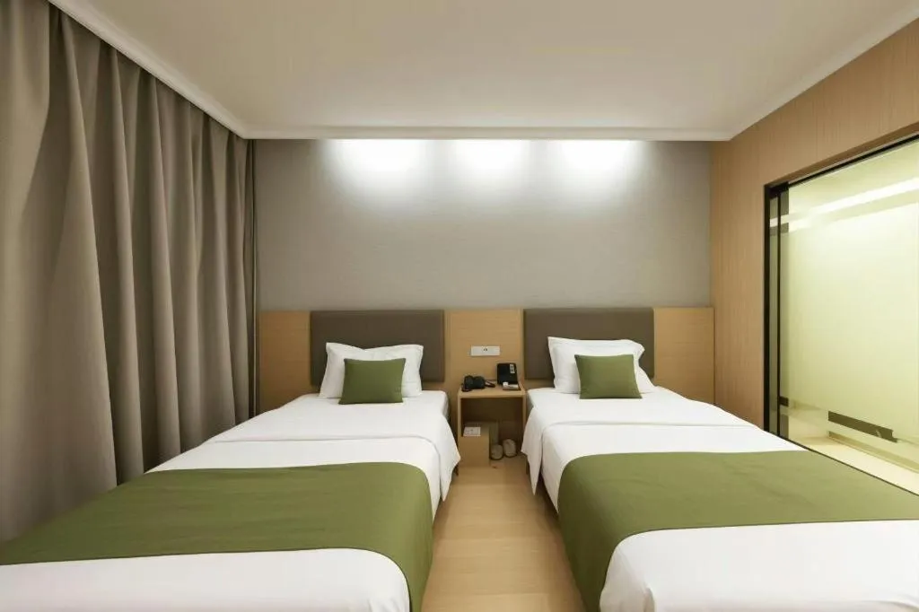 Bed in GreenTree Inn Jiangsu Suzhou Kunshan Beimen Road Express Hotel