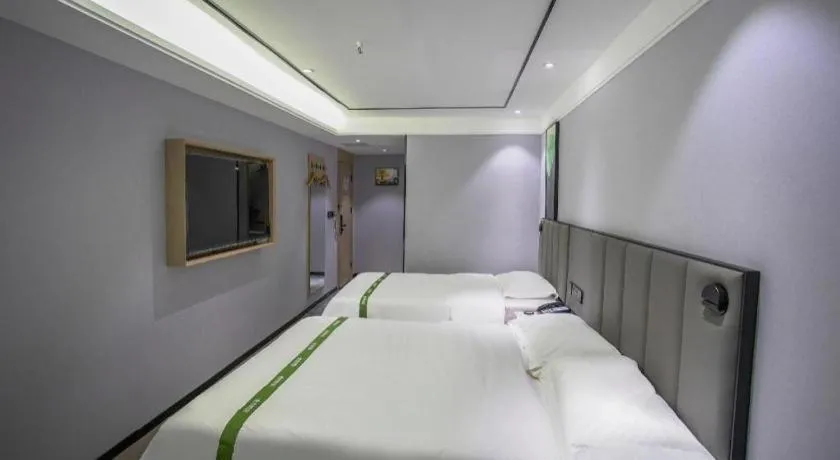 Bed in GreenTree Inn LiaoCheng LinQing HaiShan Building Express Hotel